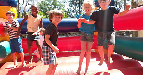 Shalom students on jumping castle